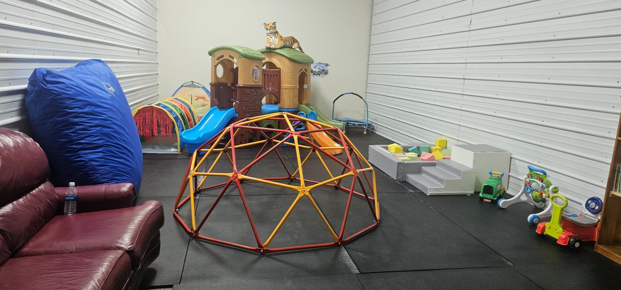 Cozy indoor play area with toys and soft seating