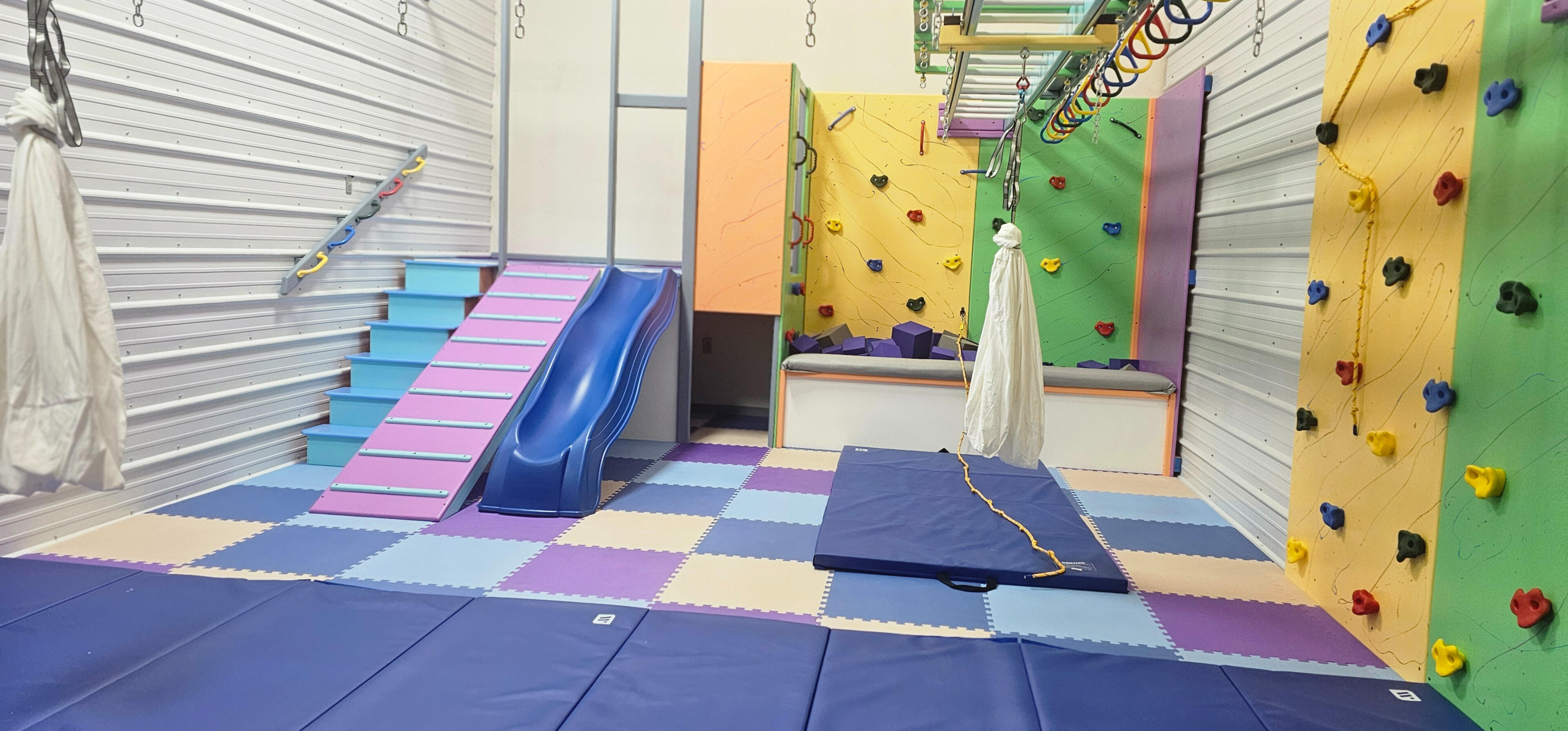 Cozy indoor play area with toys and soft seating