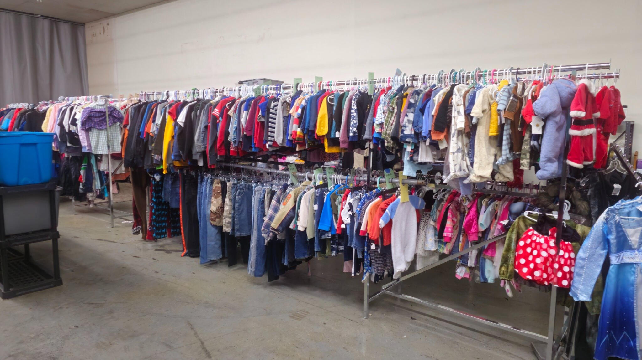 Racks of children’s clothing and winter gear